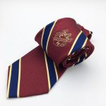 Striped repp woven crest emblematic club tie
